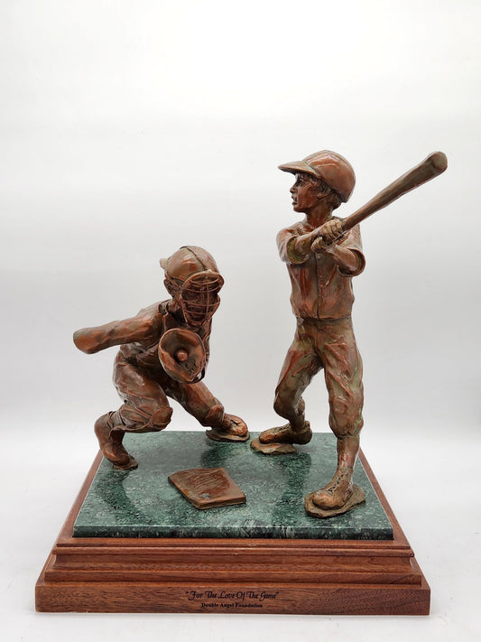 Bronze statue by Bobbie Carlyle titled For the Love of the Game