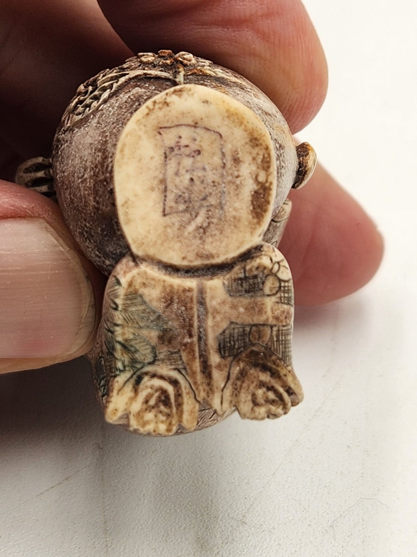 Netsuke Figurine 11 - Person with Flower Pot