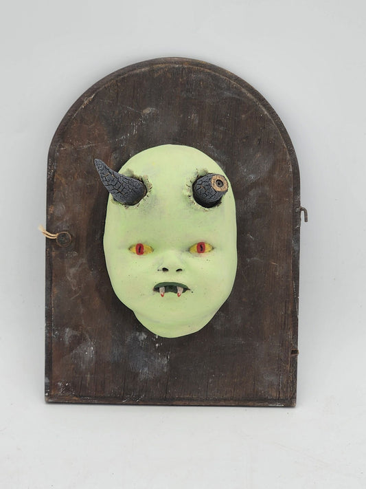 Boue Baby: Devil with horn broken from battling "God"