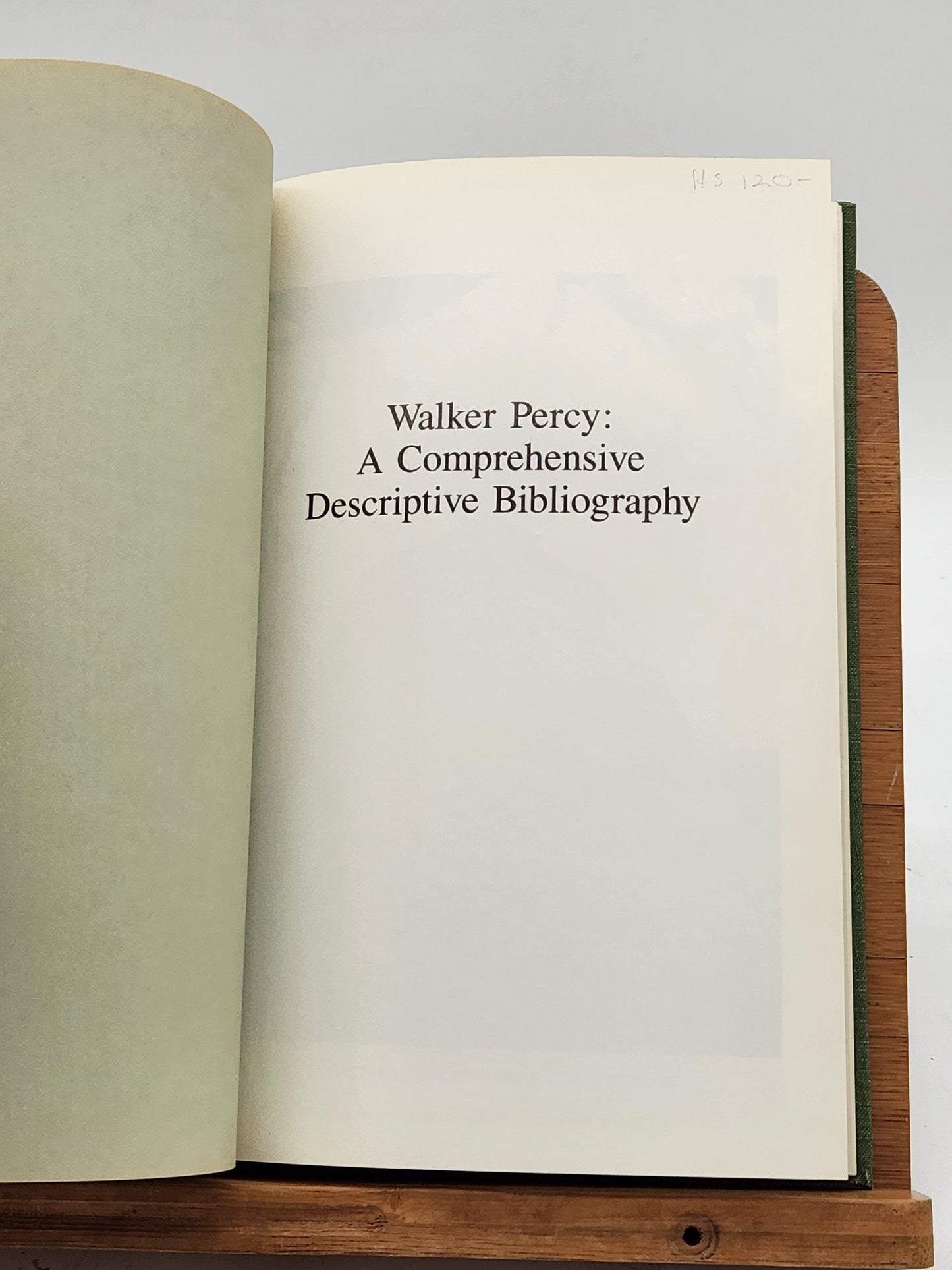 First edition of Walker Percy: A Comprehensive Descriptive Bibliography by Linda Whitney Hobson, signed by both the author and publisher, Rhoda Faust