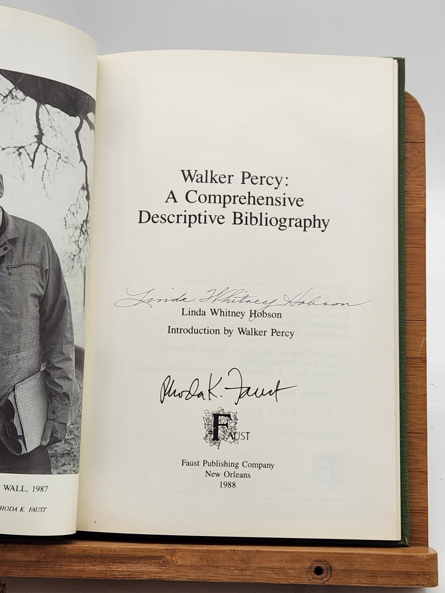 First edition of Walker Percy: A Comprehensive Descriptive Bibliography by Linda Whitney Hobson, signed by both the author and publisher, Rhoda Faust