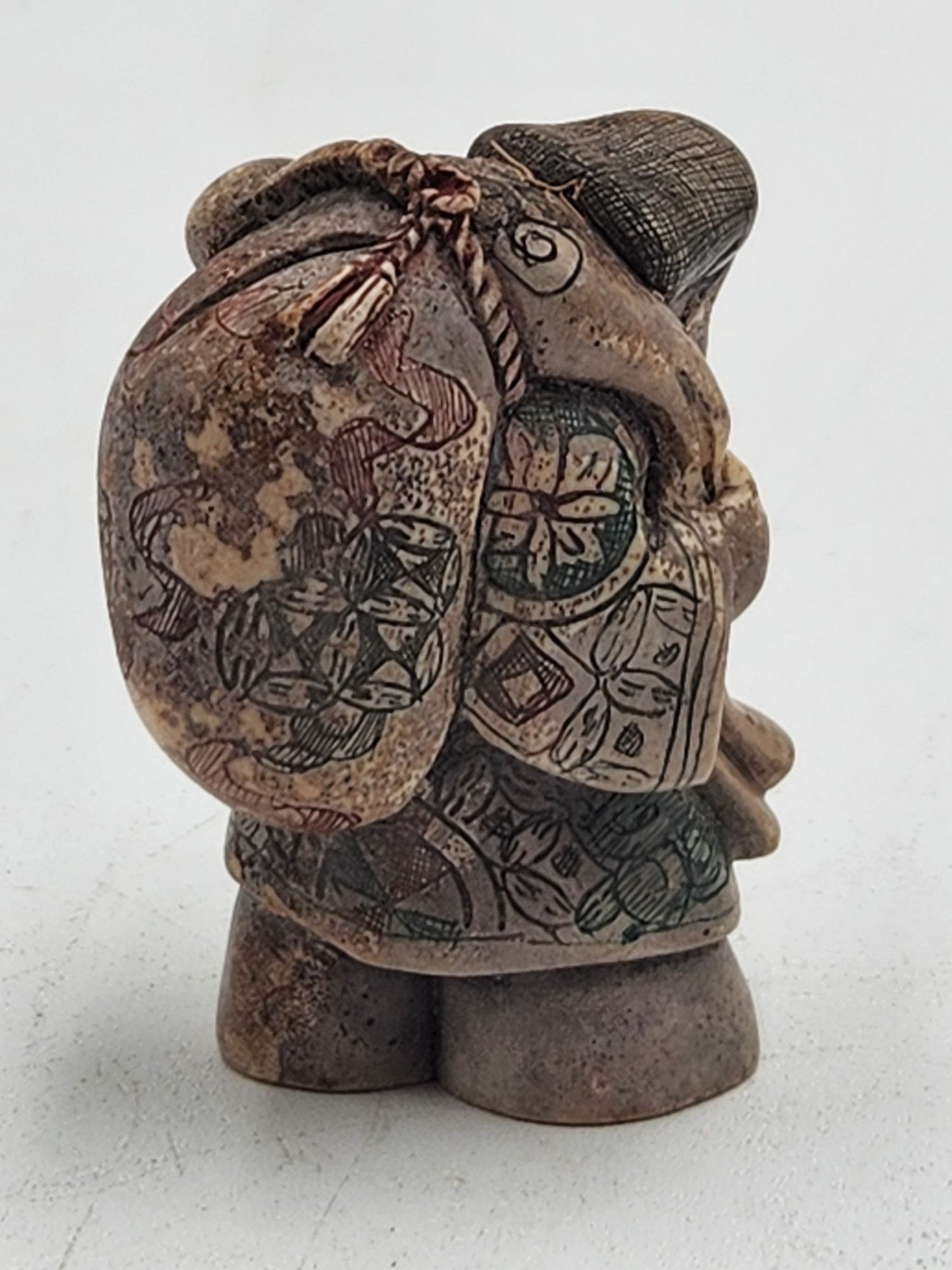 Netsuke Figurine 07 Guy Standing Carrying a Bag