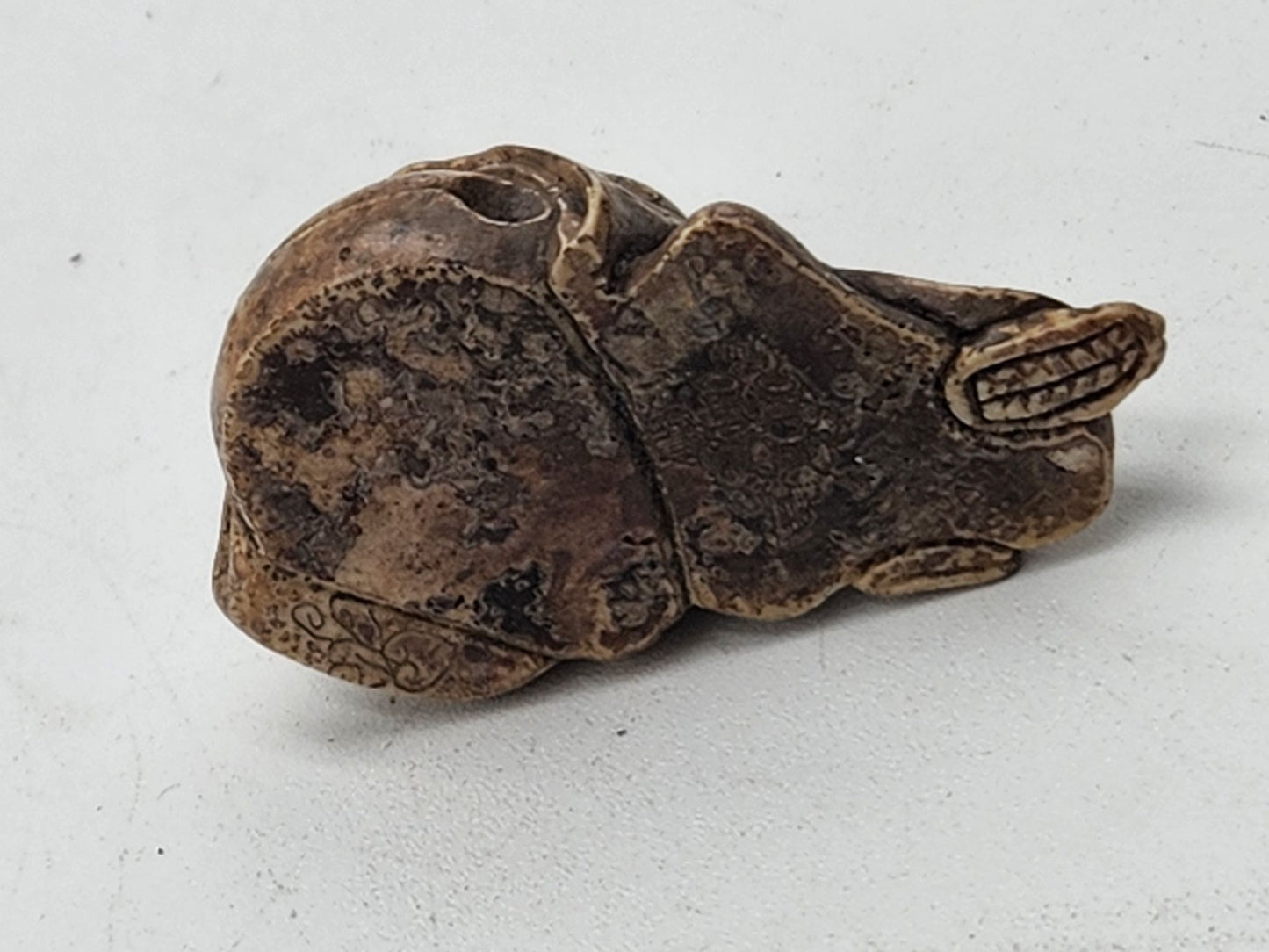 Netsuke Figurine 02 Kid Sleeping on a Bell