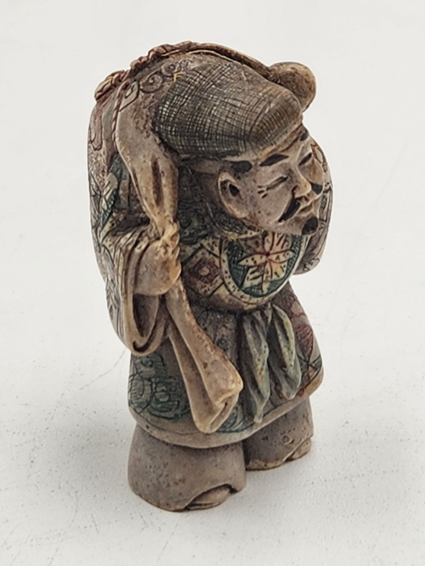 Netsuke Figurine 07 Guy Standing Carrying a Bag