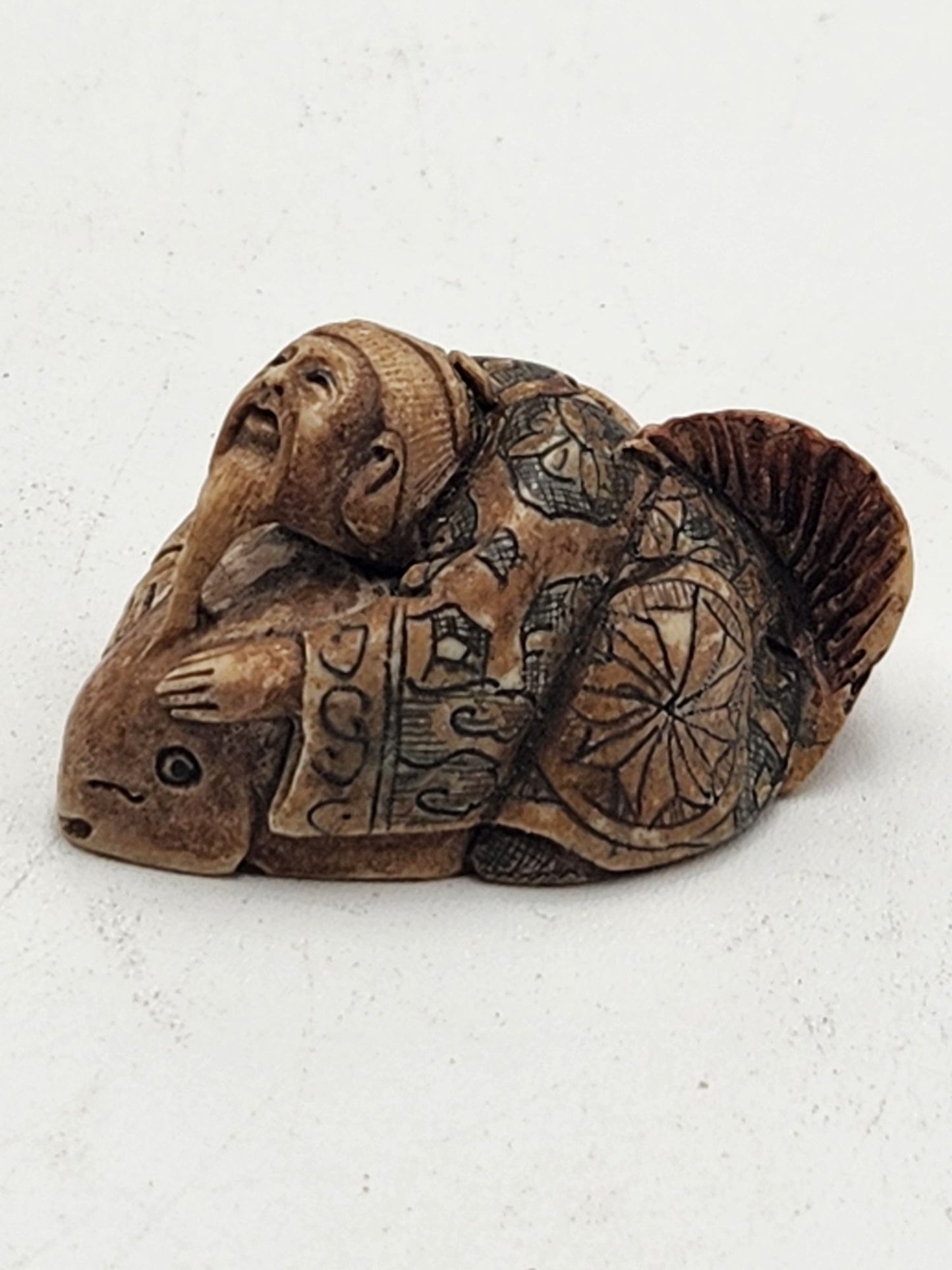 Netsuke Figurine 12 Guy Riding a Fish