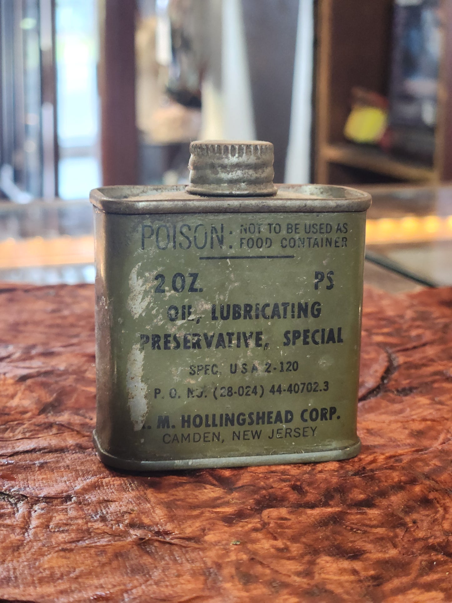 WWII U.S. Army 2 oz. oil can by M. Hollingshead Corp., Camden NJ. Olive drab military issue firearm lubricating oil tin with screw cap, marked “POISON – Not for food container”