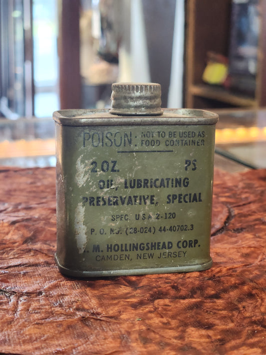 WWII U.S. Army 2 oz. oil can by M. Hollingshead Corp., Camden NJ. Olive drab military issue firearm lubricating oil tin with screw cap, marked “POISON – Not for food container”