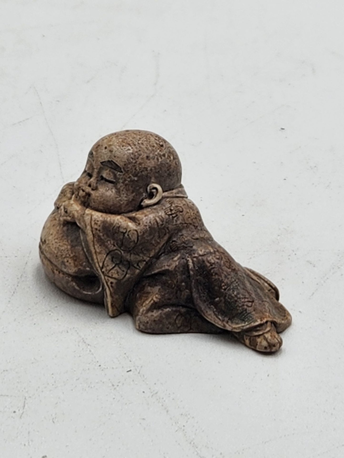 Netsuke Figurine 02 Kid Sleeping on a Bell