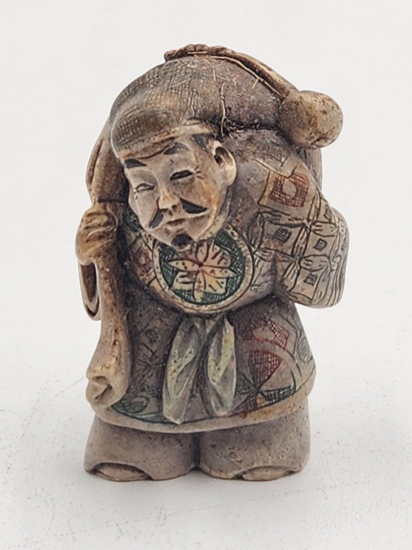 Netsuke Figurine 07 Guy Standing Carrying a Bag